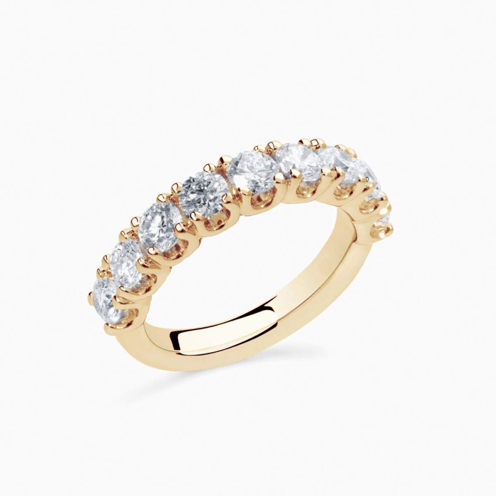 Anillo medio rivière Uma G en oro 18K con 9 diamantes y diamante interior