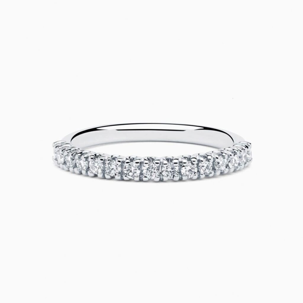 Anillo medio rivière Uma P en oro 18K con 15 diamantes y diamante interior