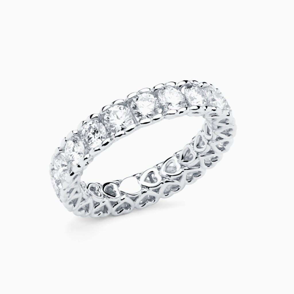 Anillo rivière Eternity G en oro 18K con 20 diamantes y diamante interior