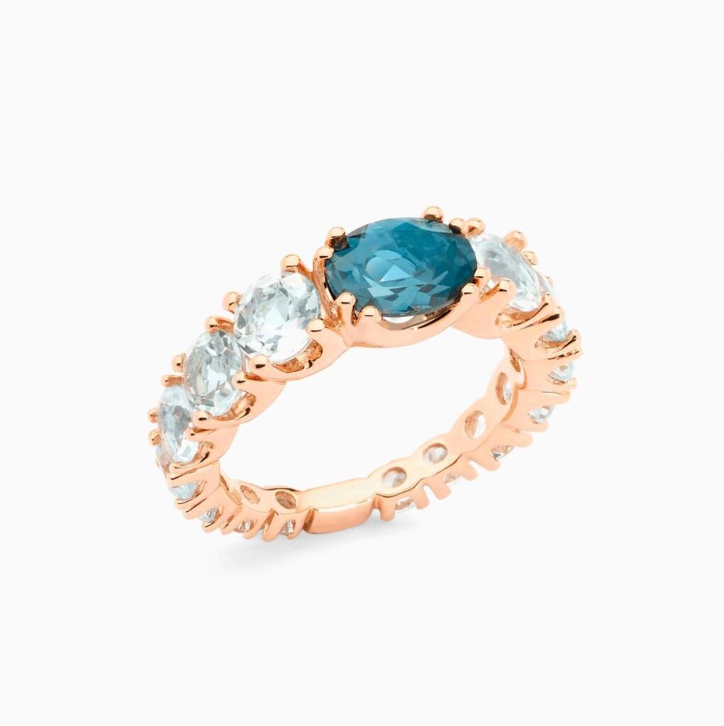 Anillo rivière Legrand B G en oro 18K con topacio azul London y topacios azul Sky