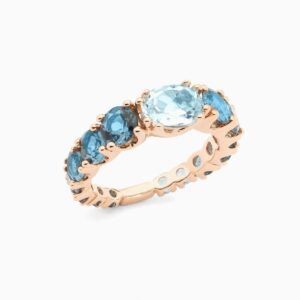 Anillo rivière Legrand D G en oro 18K con topacio Sky central y topacios London