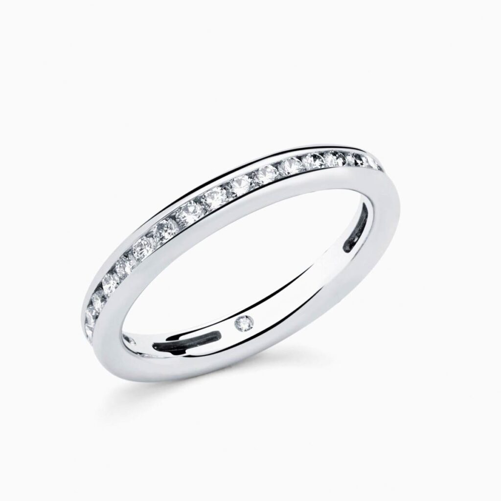 Anillo rivière Betania P en oro 18K con 18 diamantes y diamante interior