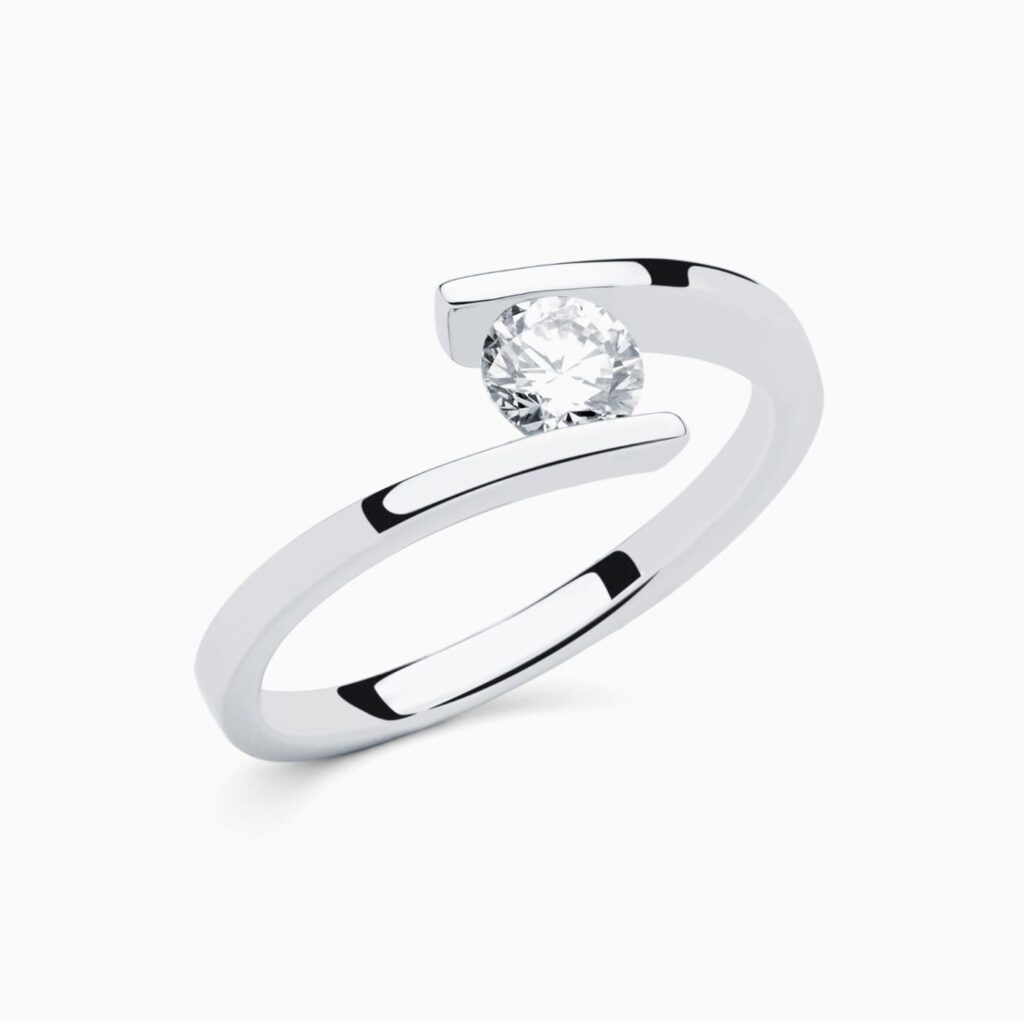 Anillo solitario Bridge G en oro 18K con diamante central y diamante interior
