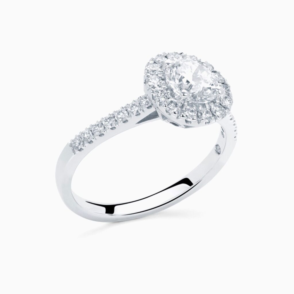 Anillo solitario pavé Brilliant G en oro 18K con diamante central, orla de diamantes y brazo de diamantes