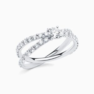Anillo solitario pavé Emy Cross P en oro 18K con diamante central, brazo cruzado de diamantes y diamante interior